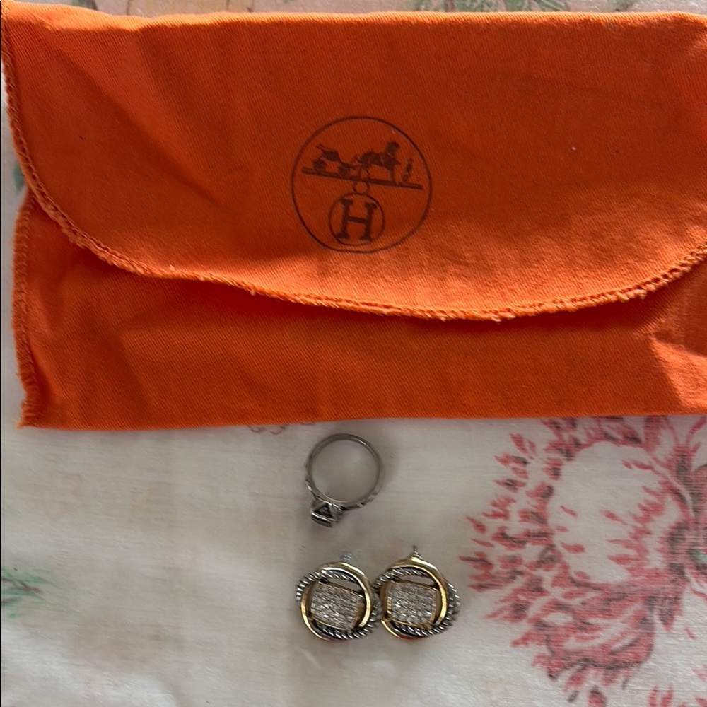 Hermès Pouch with Silver and Gold Earrings and garnet ring